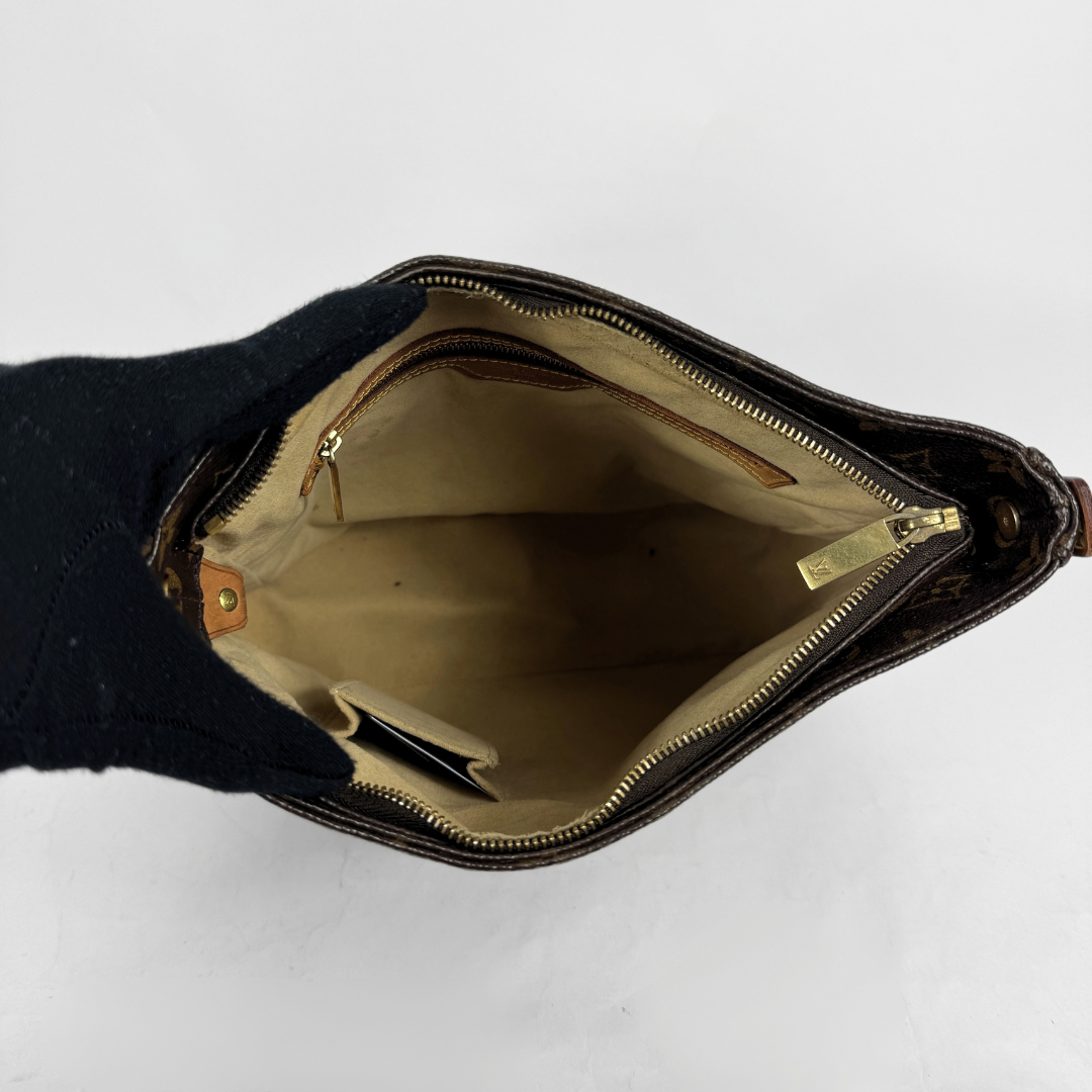 The interior of the bag, featuring two pockets, on a white background.