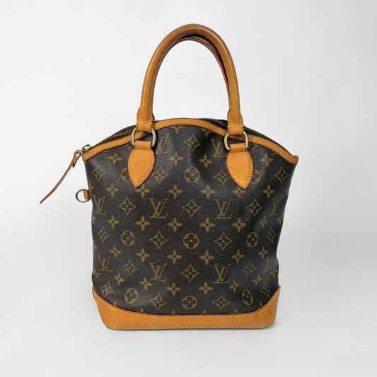 Designer handbag with monogram pattern on a white background