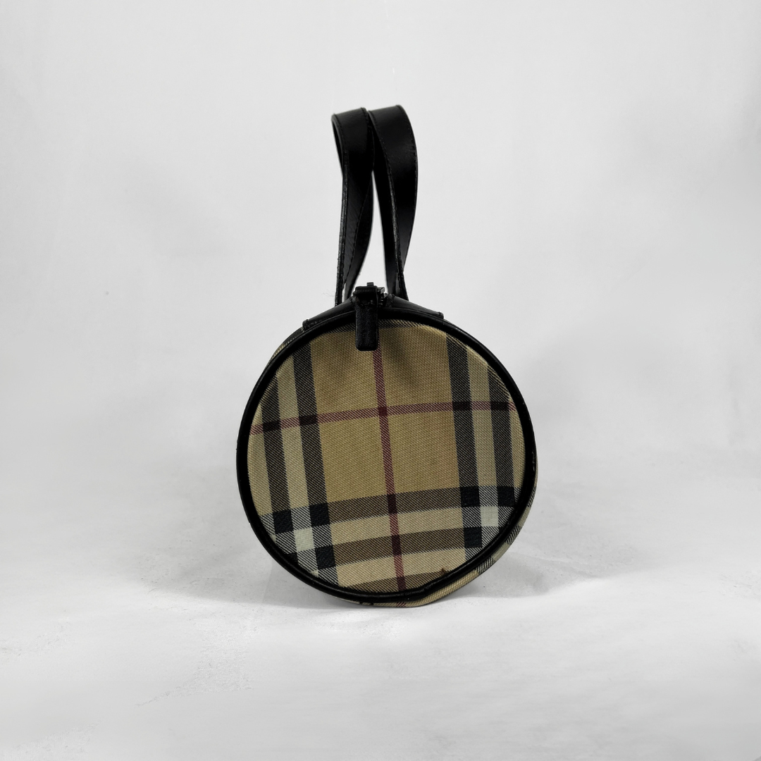 Burberry Mini Barrel handbag in the iconic beige House Check canvas with brown leather trims and details, displayed on a light grey background.