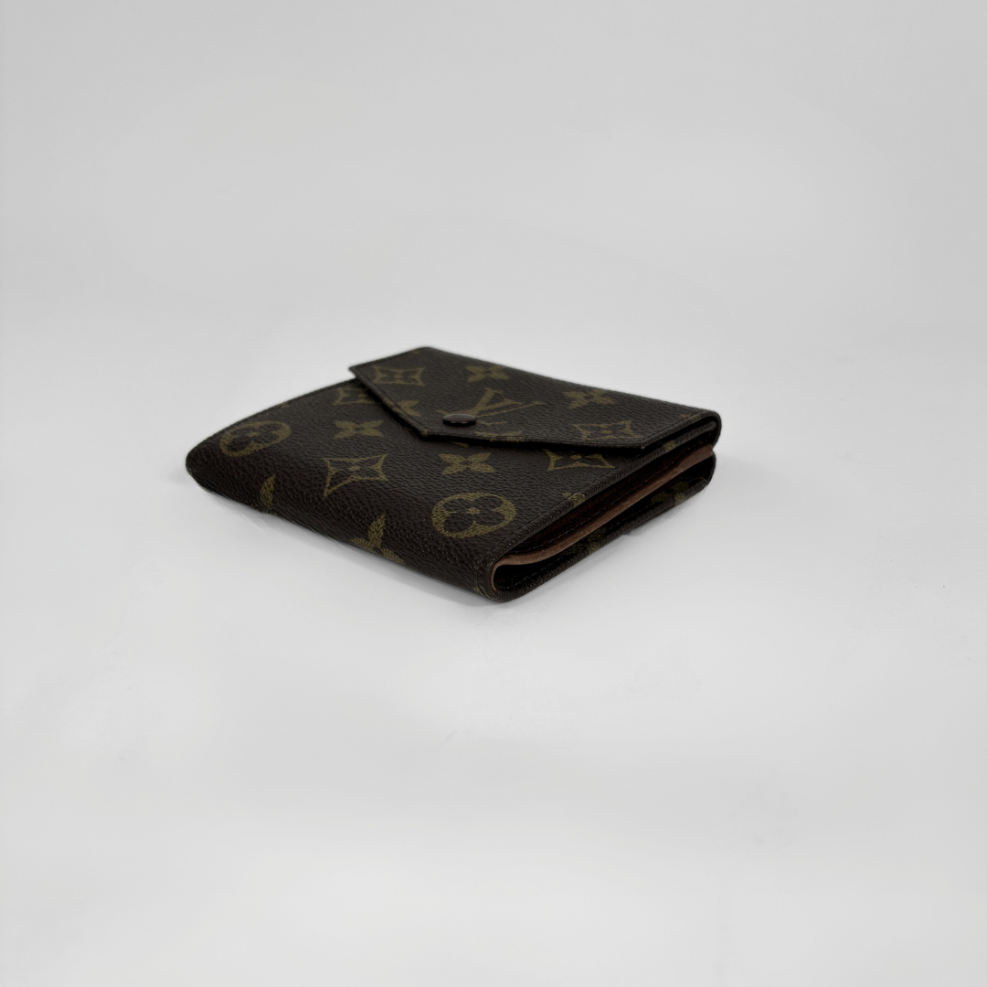 Louis Vuitton Druk Wallet on a white background