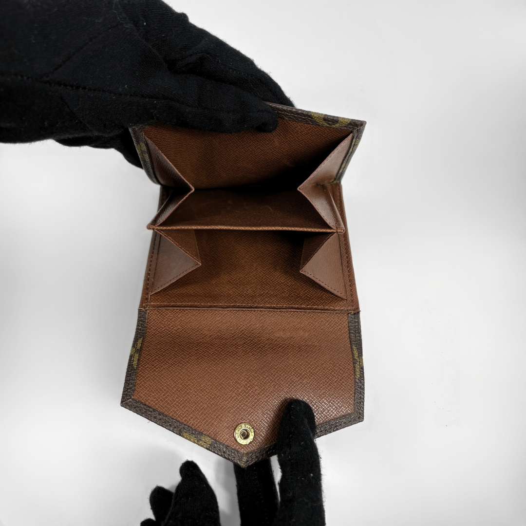 Louis Vuitton Druk Wallet on a white background
