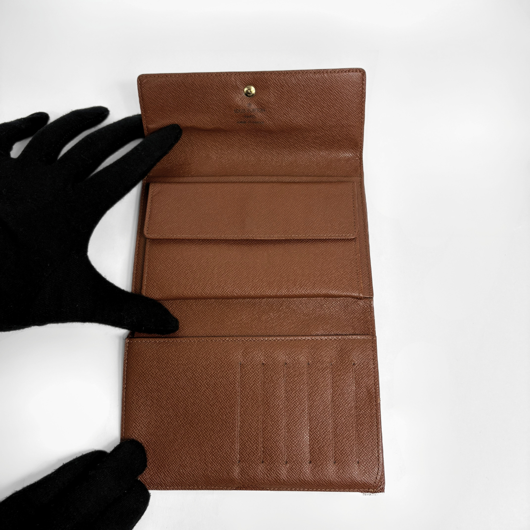 Louis Vuitton International Wallet Medium on a white background