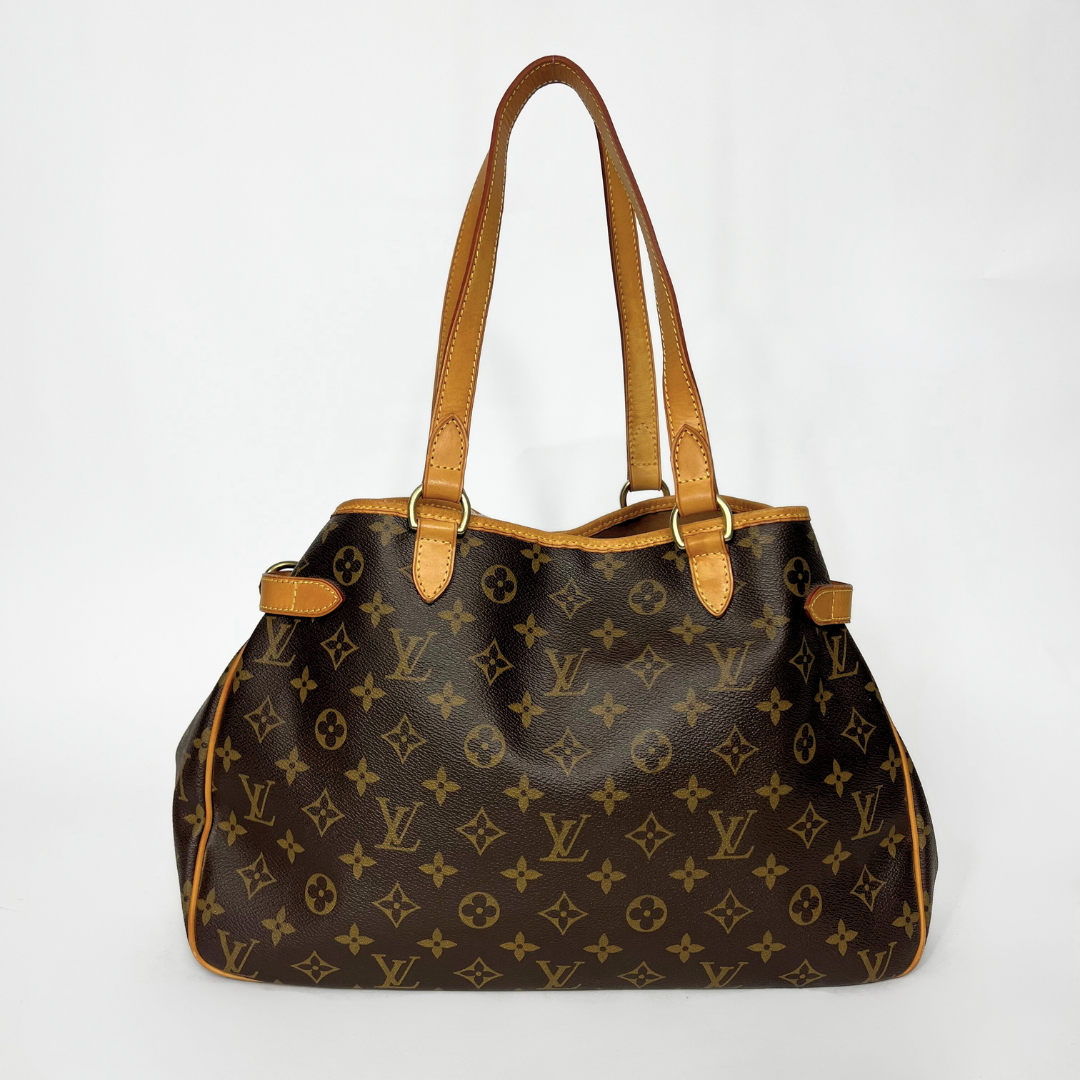 Designer handbag with monogram pattern on a white background