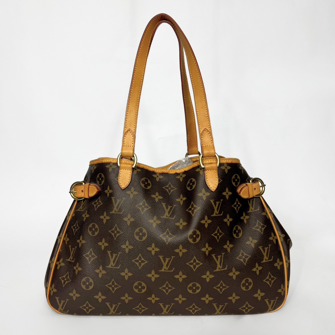 Designer handbag with monogram pattern on a white background