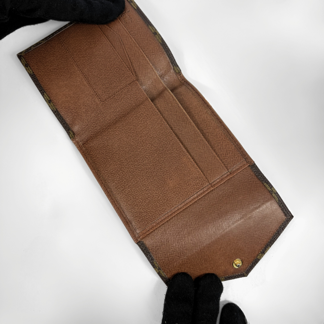 Louis Vuitton Druk Wallet on white background