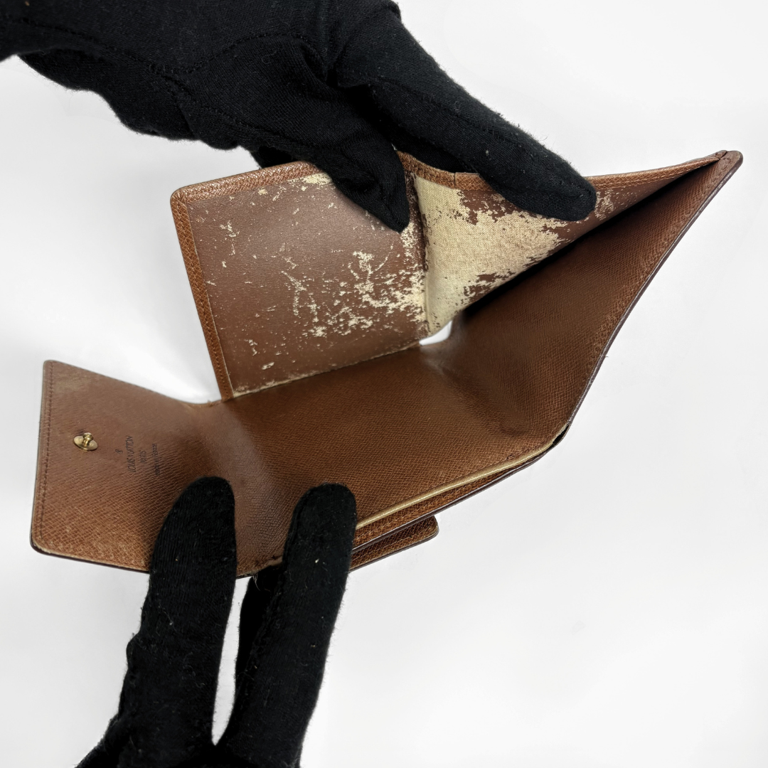 Louis Vuitton Druk Wallet on a white background