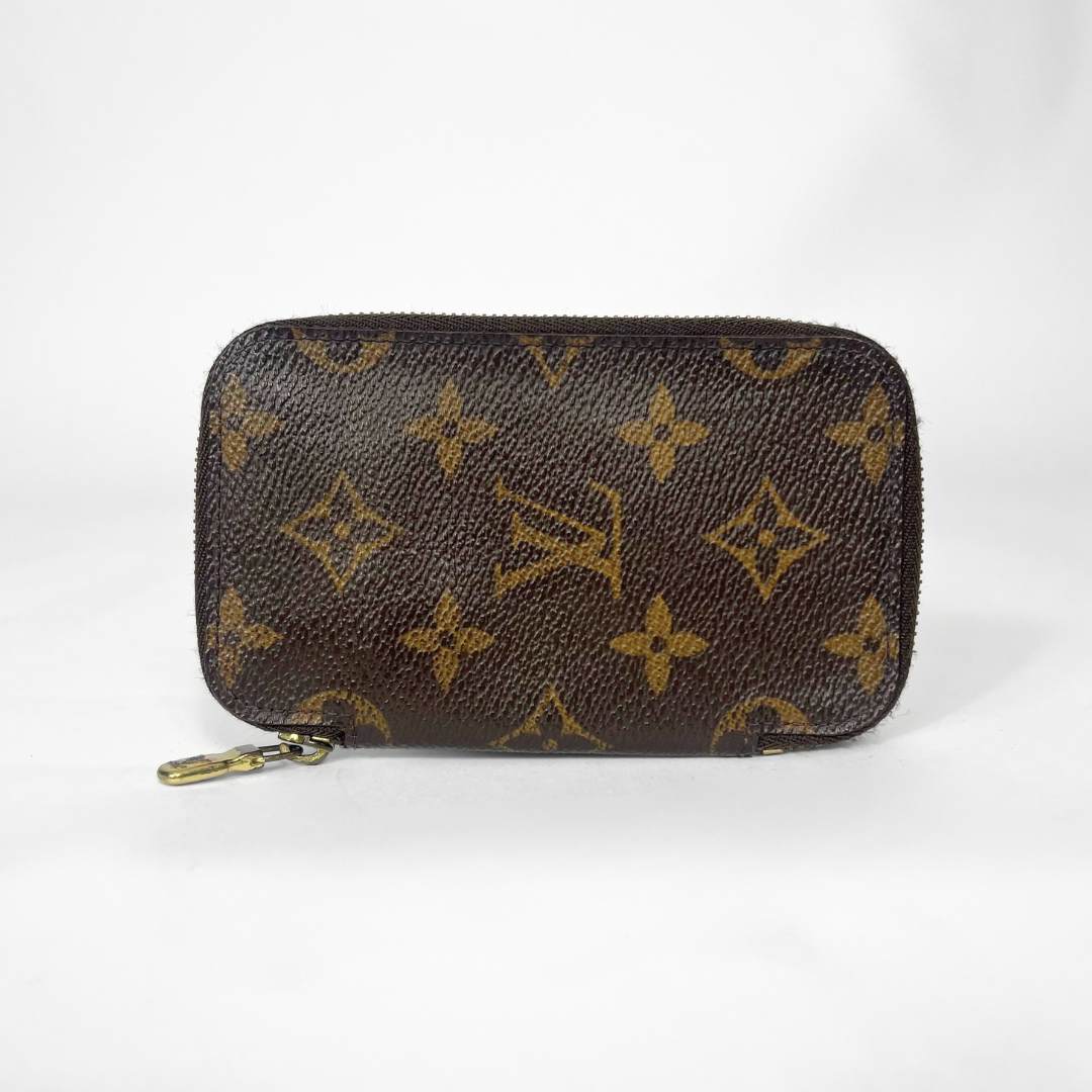 Brown monogram patterned wallet on a white background