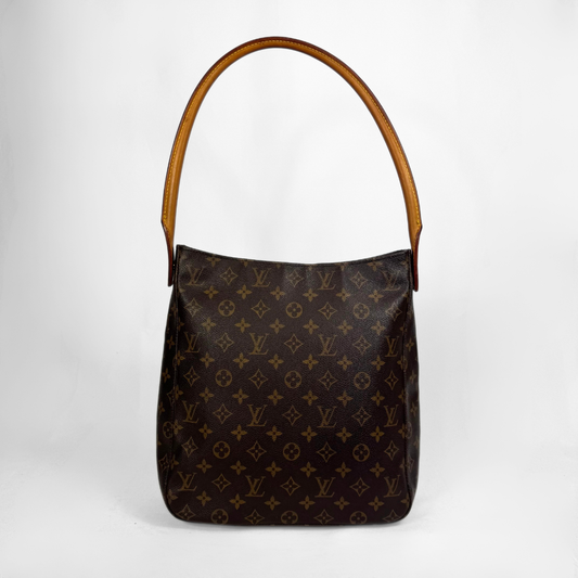 A Louis Vuitton monogram canvas shoulder bag with a brown leather handle, shown against a plain light gray background.