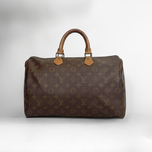 A classic Louis Vuitton monogram canvas duffel bag with brown leather handles and gold-tone hardware, photographed against a neutral light gray background.