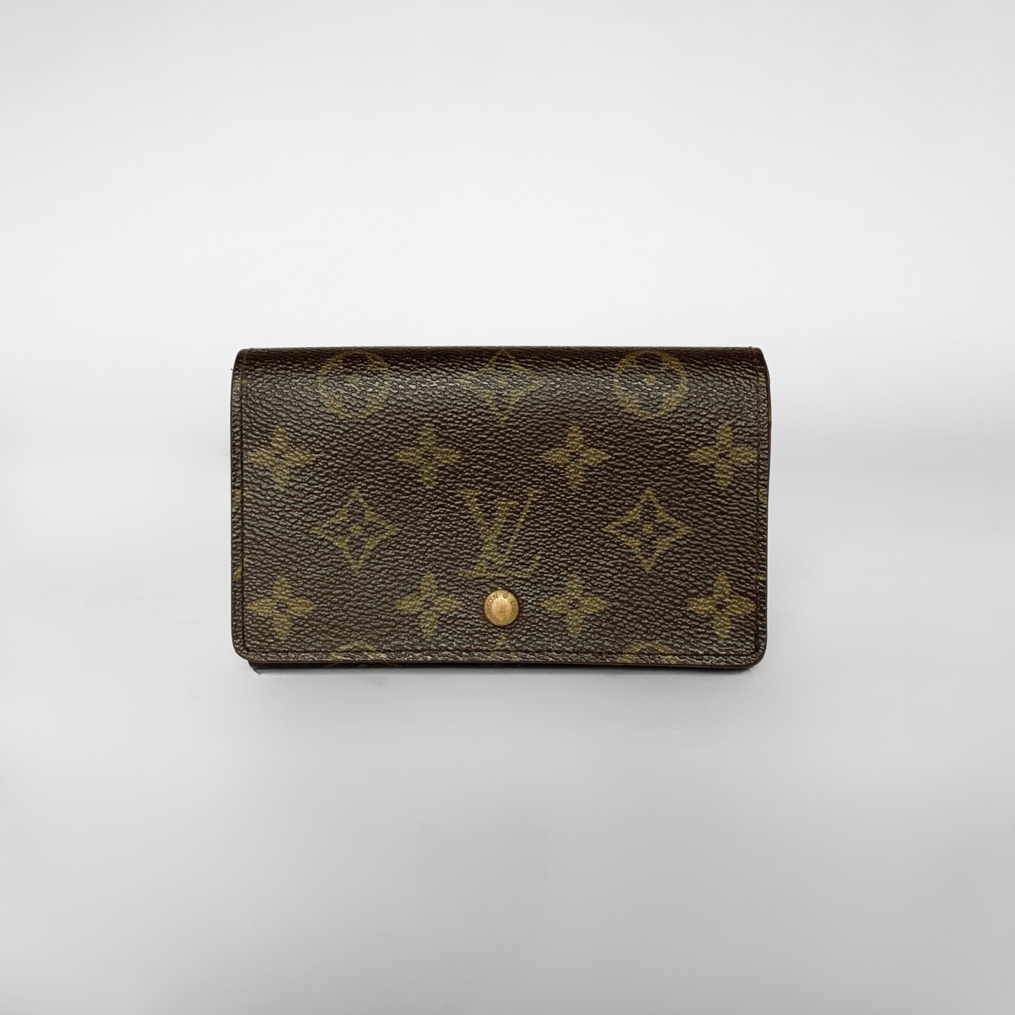 Louis Vuitton wallet with monogram pattern on a white background