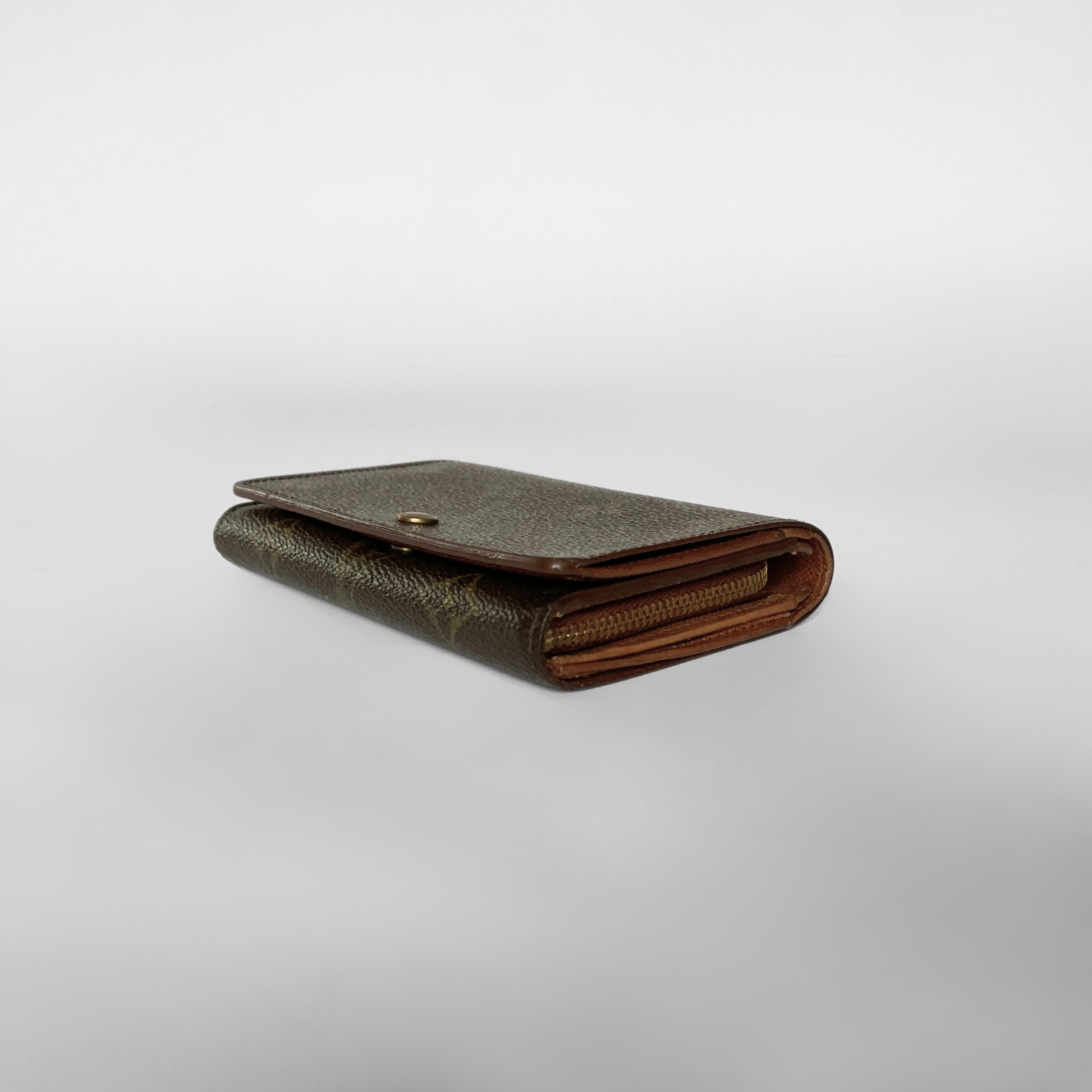 Brown leather wallet on a light gray background