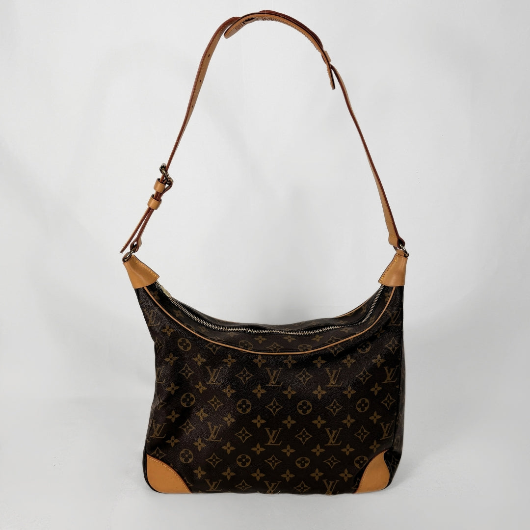 Louis Vuitton monogram canvas shoulder bag with tan leather trim and a brown leather shoulder strap, shown against a plain light gray background.