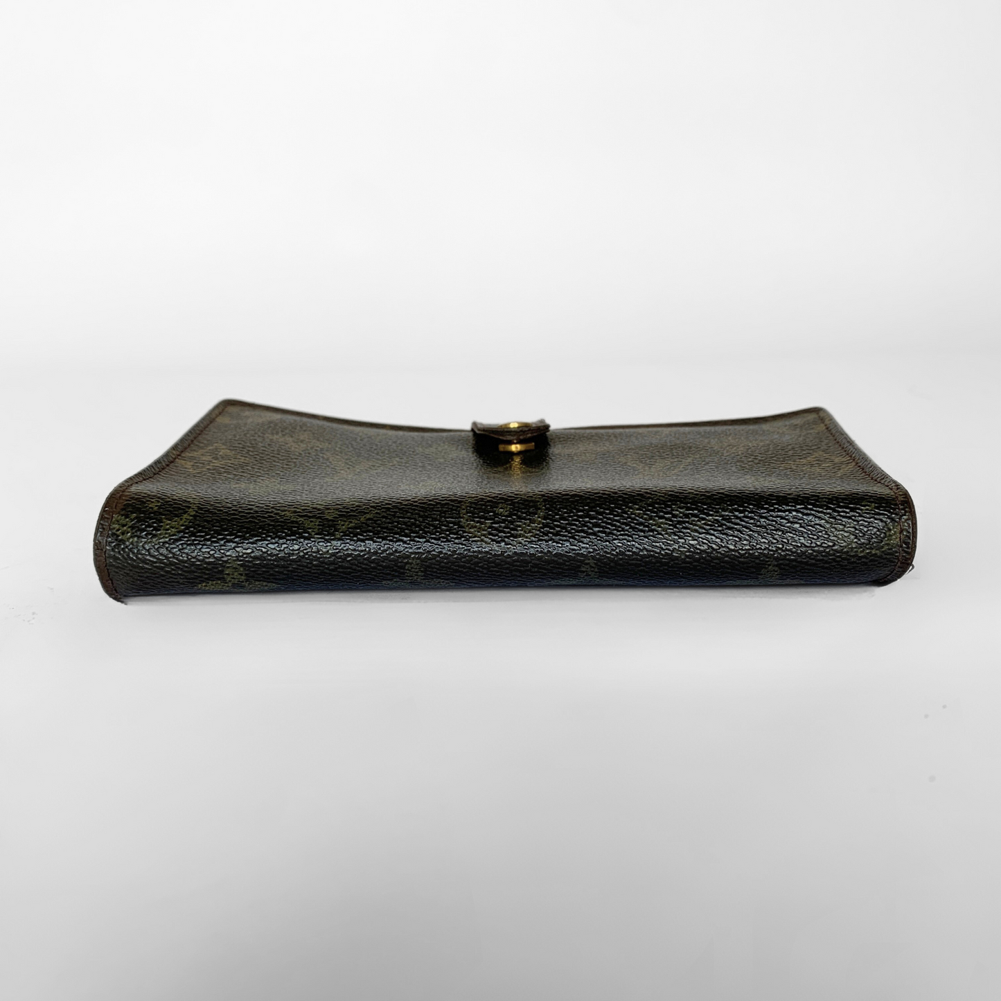 A dark brown textured leather clutch bag with a small gold button closure, shown against a plain white background.