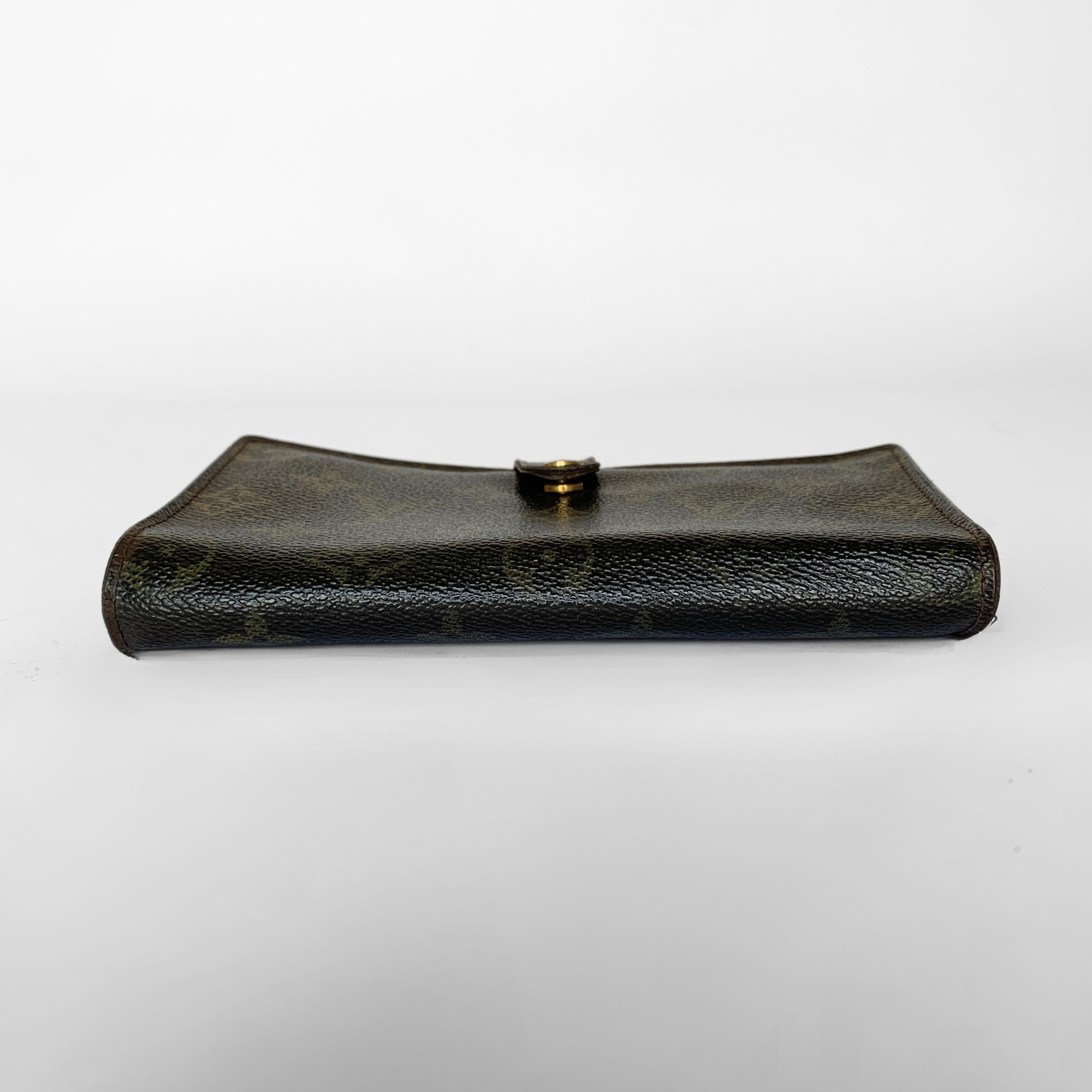 A dark brown textured leather clutch bag with a small gold button closure, shown against a plain white background.