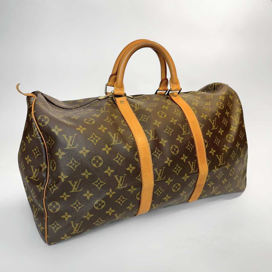 Brown Louis Vuitton bag with monogram pattern on a white background