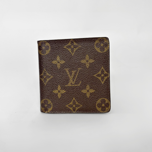 Louis Vuitton wallet with monogram pattern on a white background
