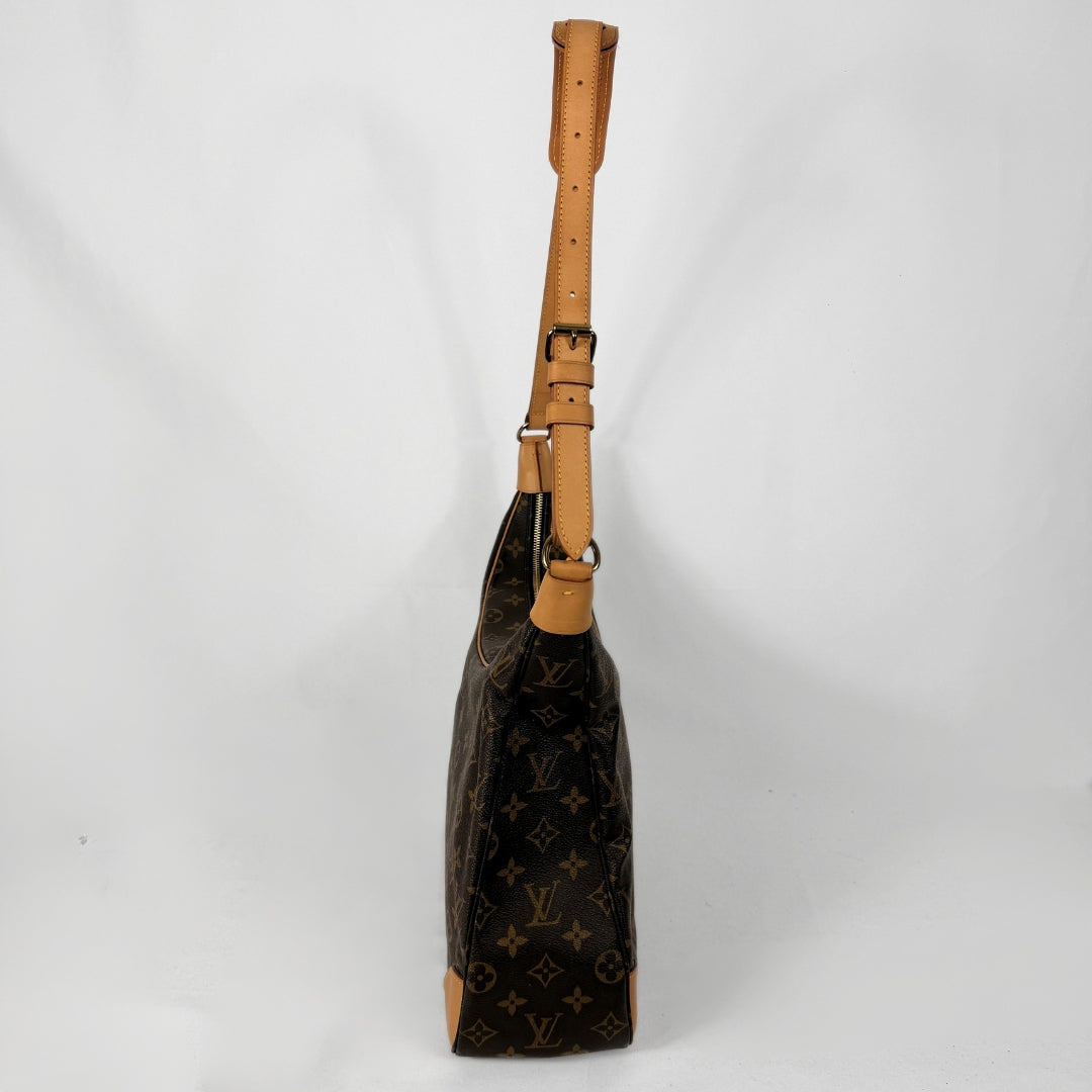 A Louis Vuitton shoulder bag in brown monogram canvas with tan leather trim and strap, shown from a side profile view against a white background.