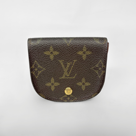 Louis Vuitton monogram wallet on a white background