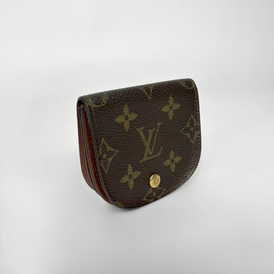 Louis Vuitton monogram wallet on a white background