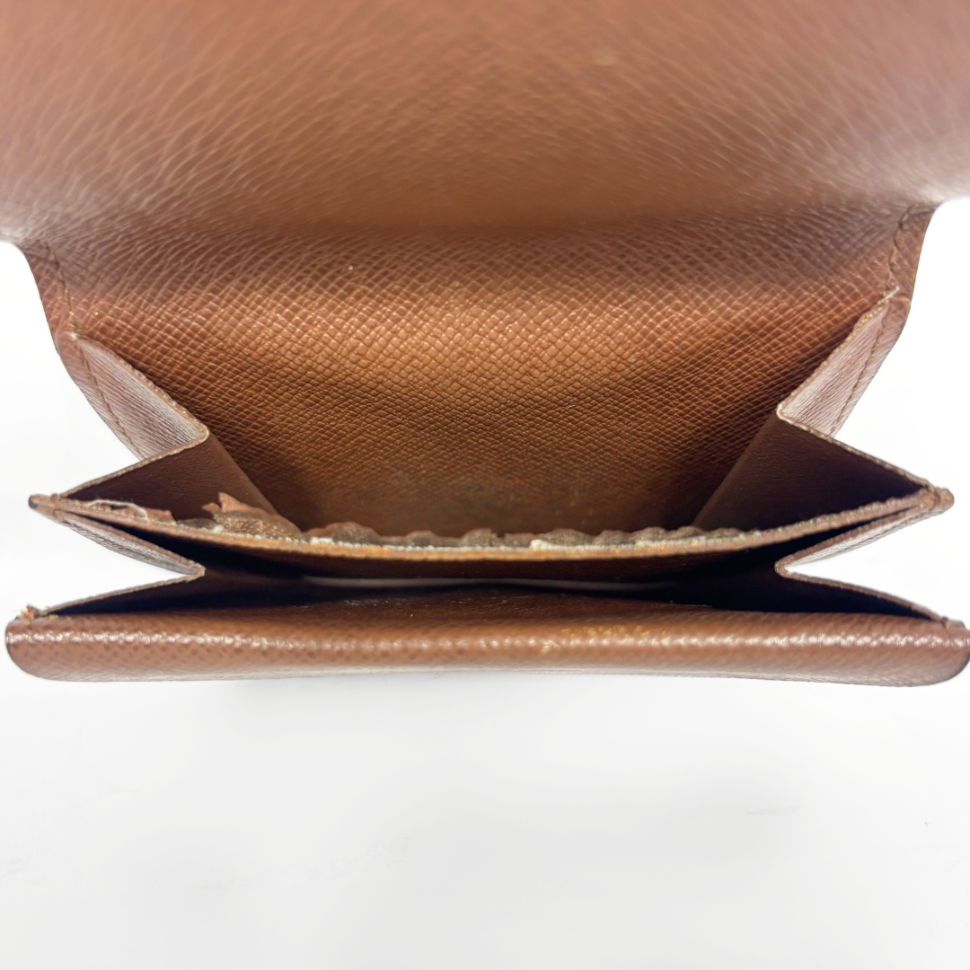 Close-up of a brown leather wallet on a white background
