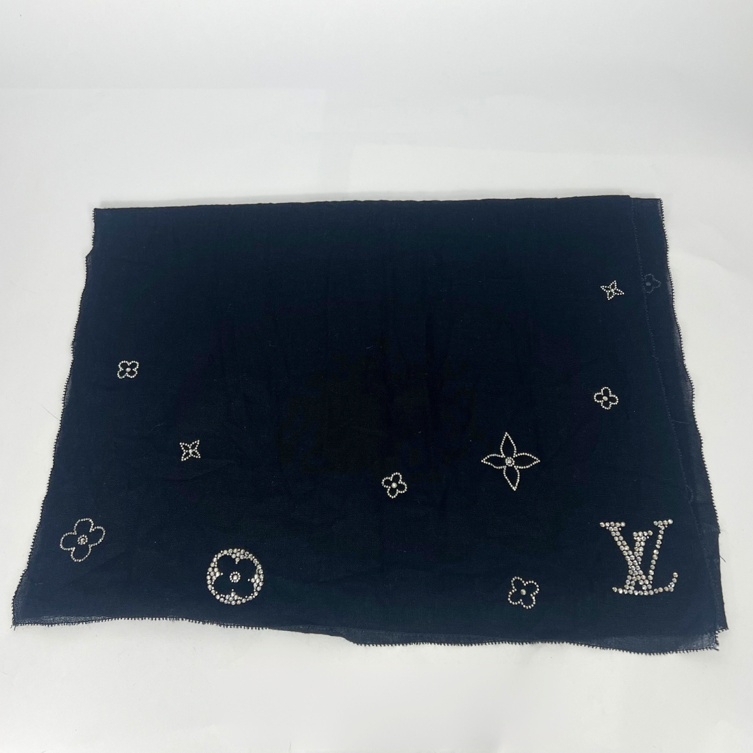 Black scarf with embroidered patterns on a white background