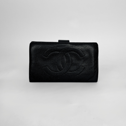 A black textured leather clutch wallet featuring an embossed interlocking CC logo, characteristic of Chanel, set against a plain light gray background.