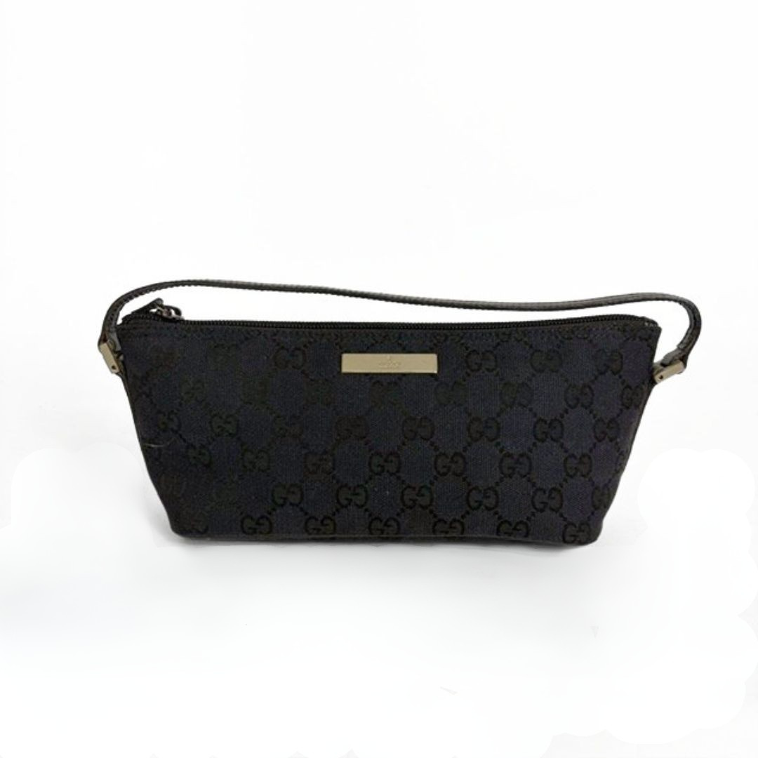 Gucci Boat Pochette in Canvas with the classic Gucci print on a white background