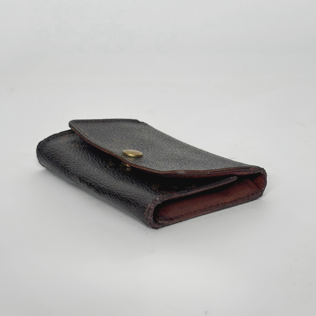 Black leather wallet on a light gray background
