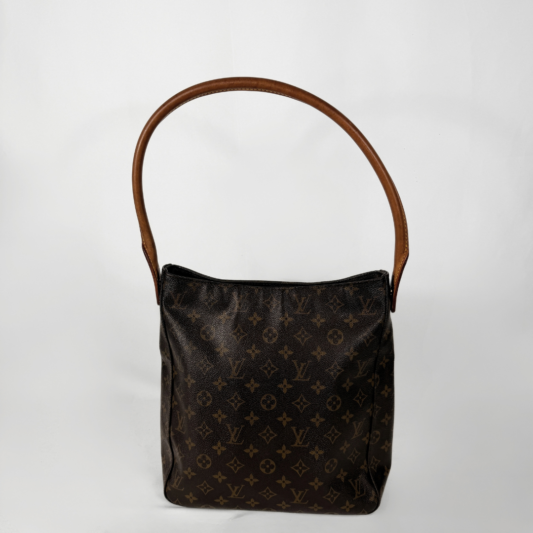 A vintage Louis Vuitton monogram canvas shoulder bag with a brown leather handle, shown against a plain white background.