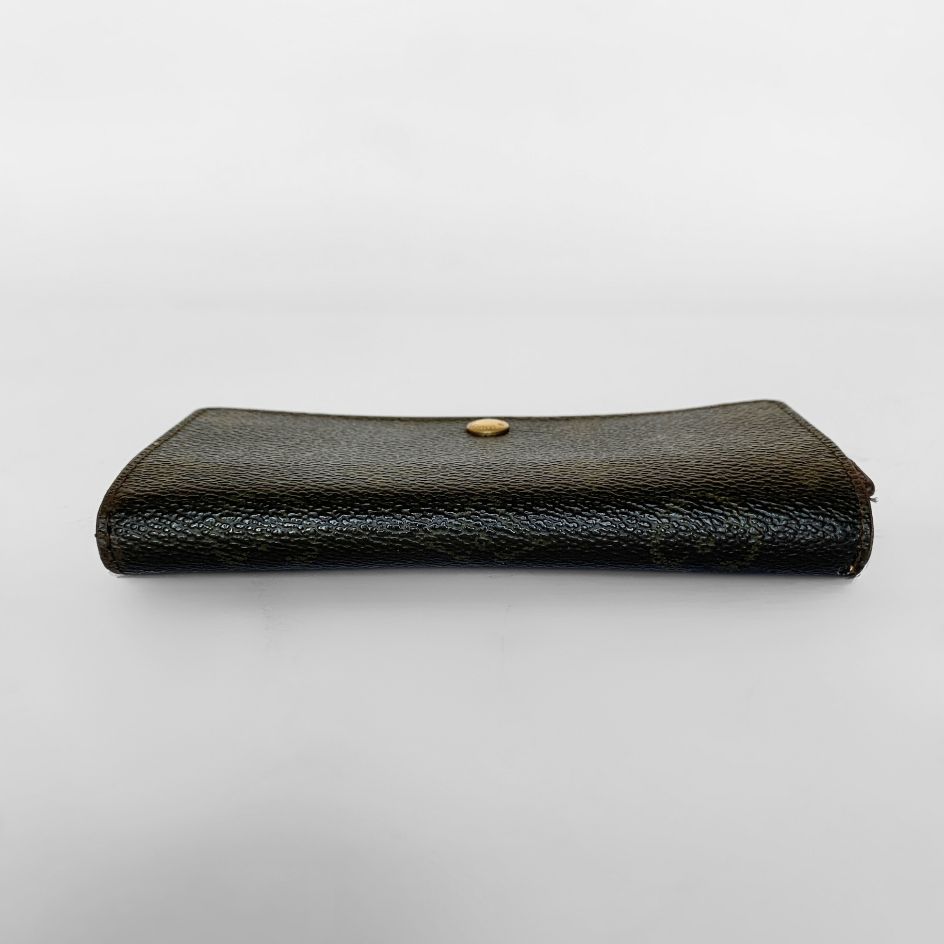 Black leather wallet with a gold button on a white background