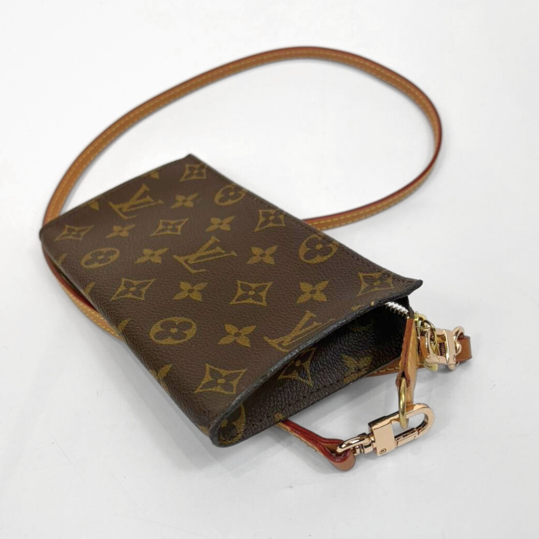 Louis Vuitton monogram handbag with gold hardware on a white background