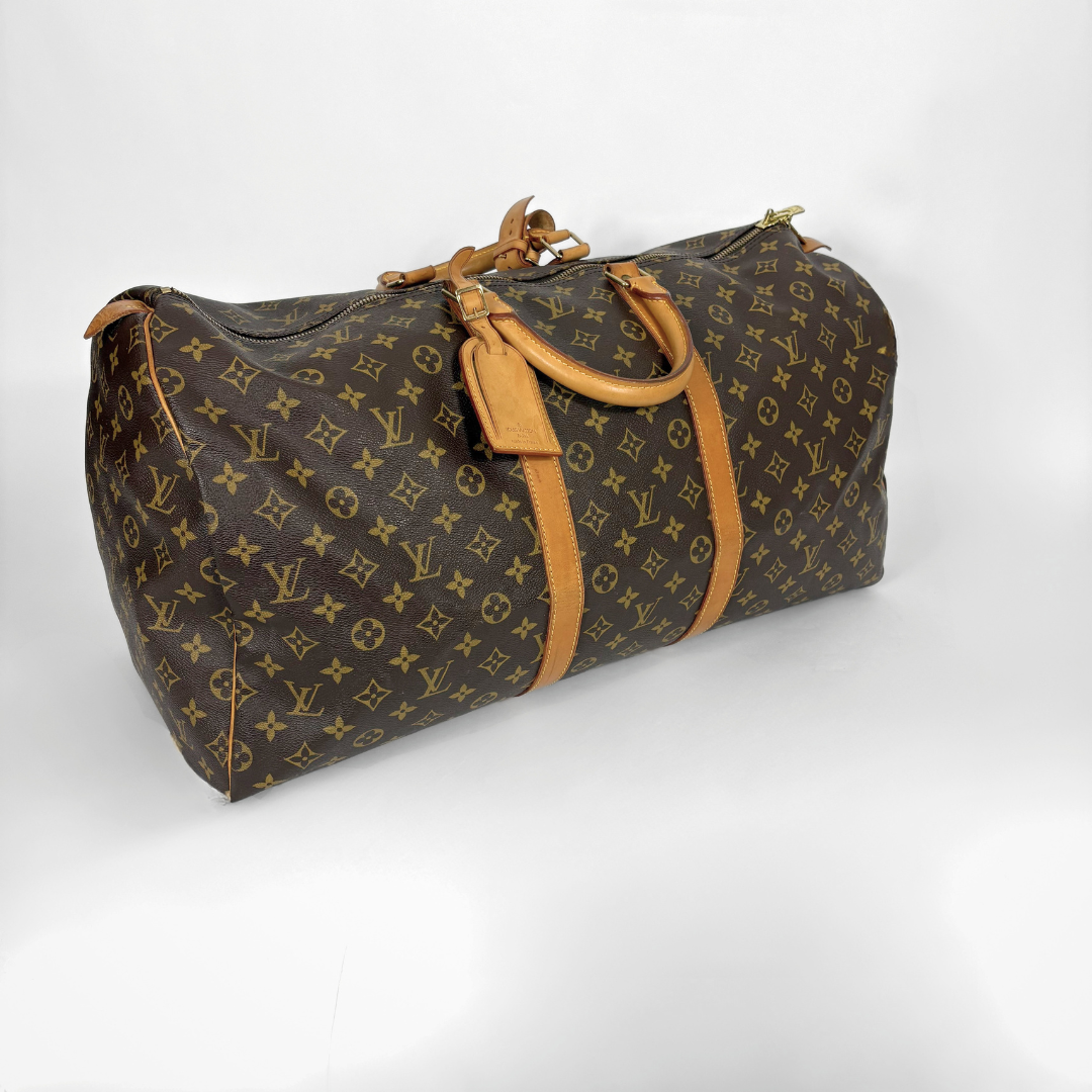 Louis Vuitton monogram duffel bag on a white background