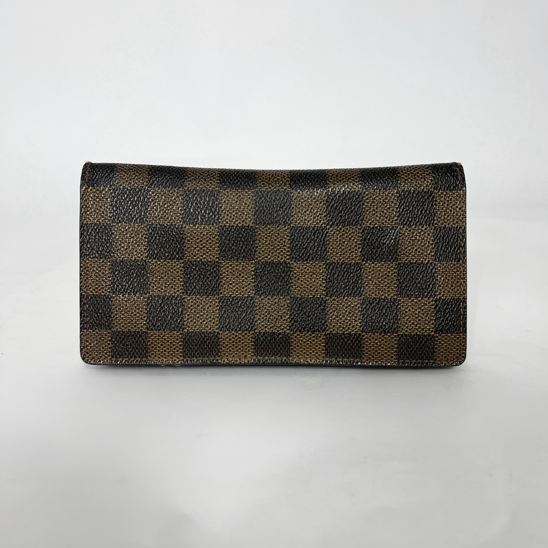 Checkered wallet with brown and black pattern on a white background