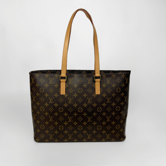 Designer handbag with monogram pattern on a white background
