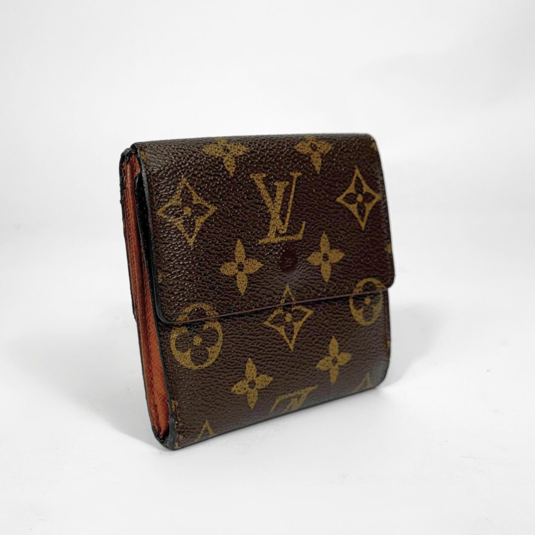 Louis Vuitton wallet with monogram pattern on a white background