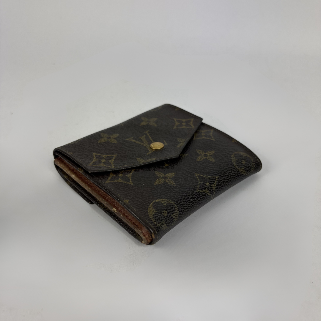 Louis Vuitton Druk Wallet on a white background