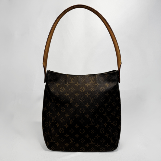 Louis Vuitton monogram canvas shoulder bag with a brown leather handle, photographed against a light gray background.