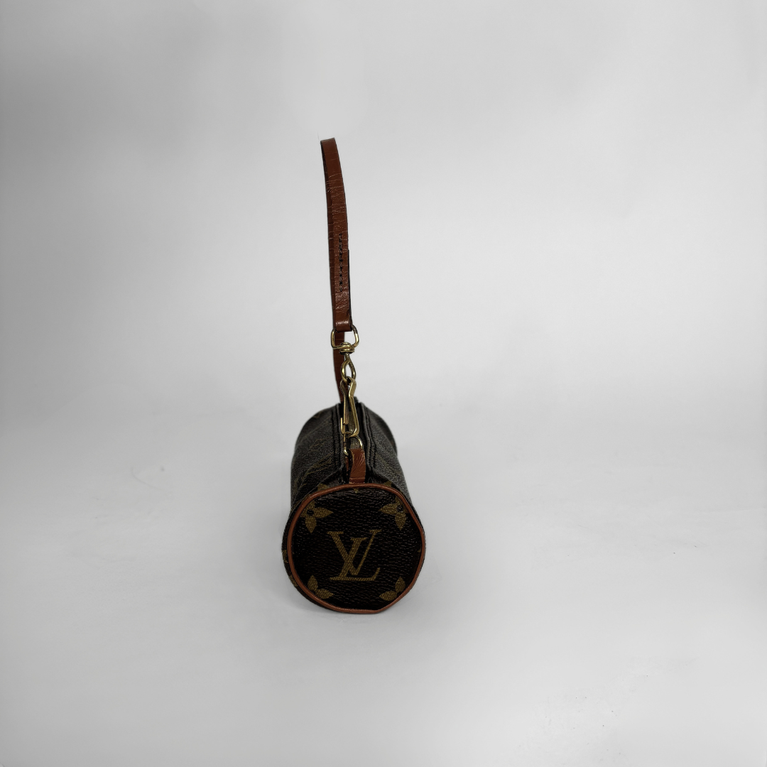 A Louis Vuitton monogram canvas cylindrical shoulder bag with a brown leather strap and gold-tone hardware, shown against a plain light gray background.