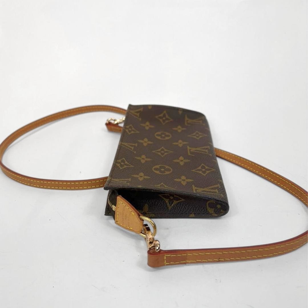 Designer handbag with monogram pattern on a white background
