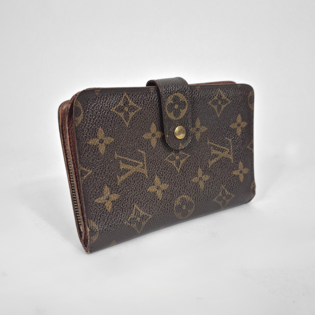 Brown wallet with monogram pattern on a white background