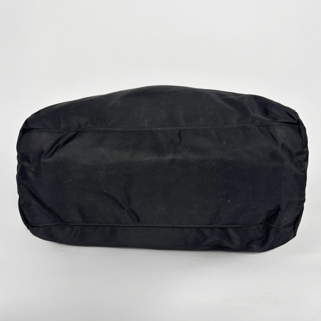 Prada black nylon tote bag with top handles and the classic enamel triangle logo.