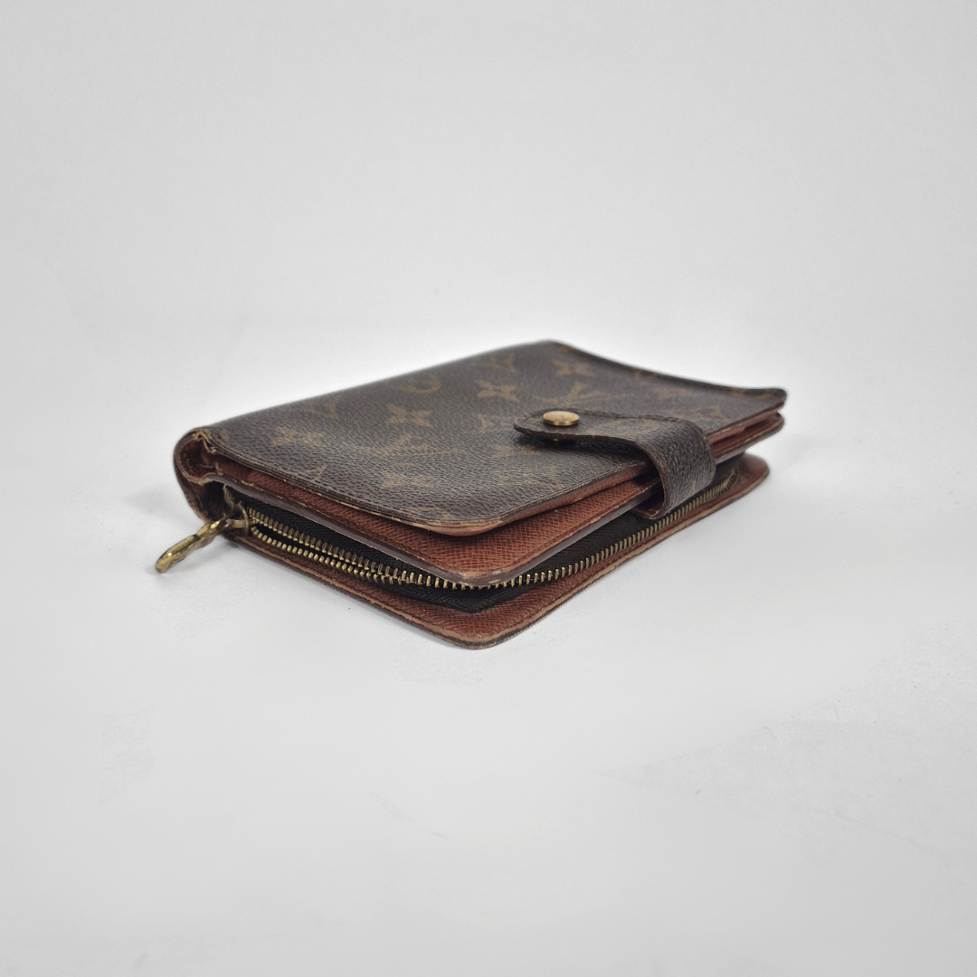 Brown wallet with gold accents on a white background