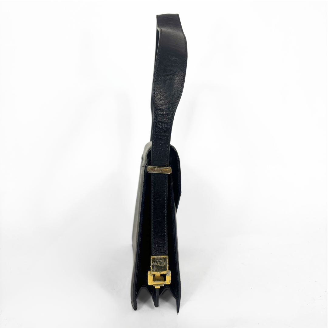 Celine vintage black leather shoulder bag with gold-tone horse and cariage buckle.
