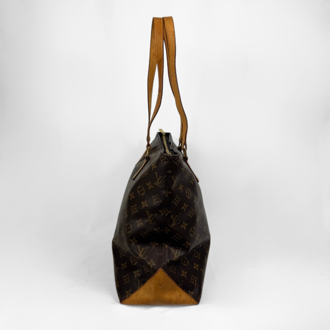 A Louis Vuitton monogram canvas shoulder bag shown from the back, featuring dark brown coated canvas with the classic tan monogram pattern and tan leather trim and handles, set against a plain white studio background.