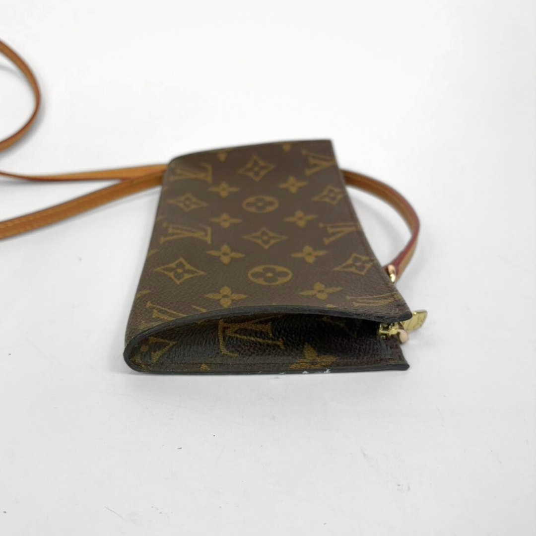 Brown monogram handbag with a strap on a white background