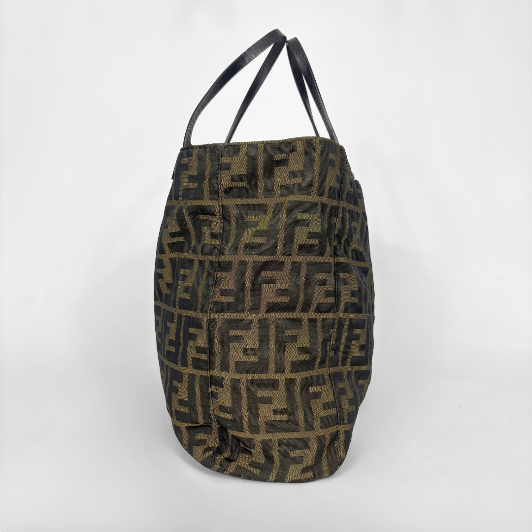 Fendi shopper bag in brown and black Zucca monogram canvas with black leather handles.