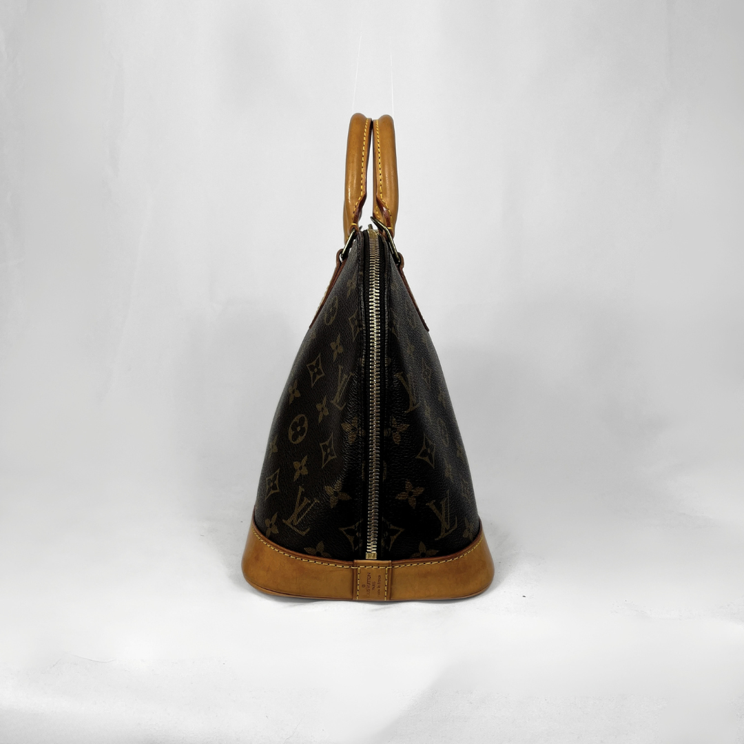 Louis Vuitton Alma Monogram Canvas on a white background