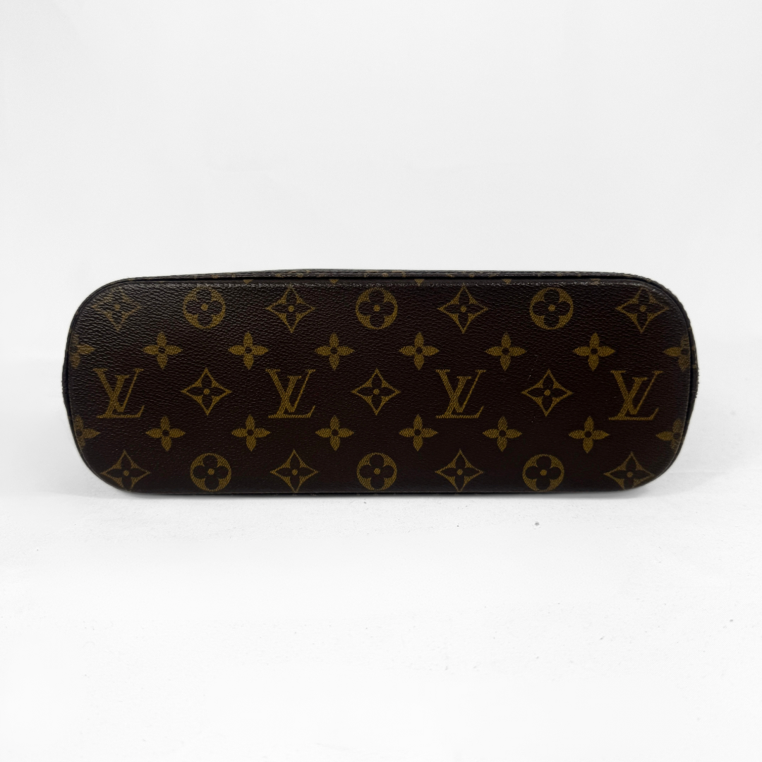 Louis Vuitton monogram canvas bag in dark brown with gold-tone LV logos and floral motifs, shown against a plain white background.