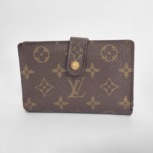 Brown leather wallet with gold accents on a light gray background