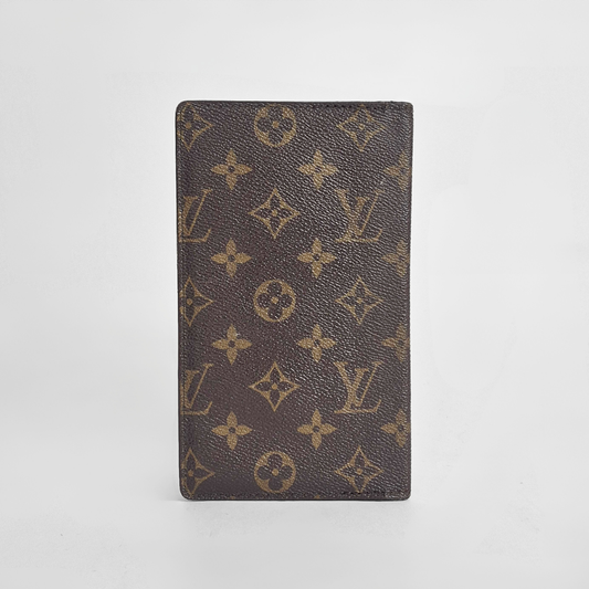Louis Vuitton wallet with monogram pattern on a white background